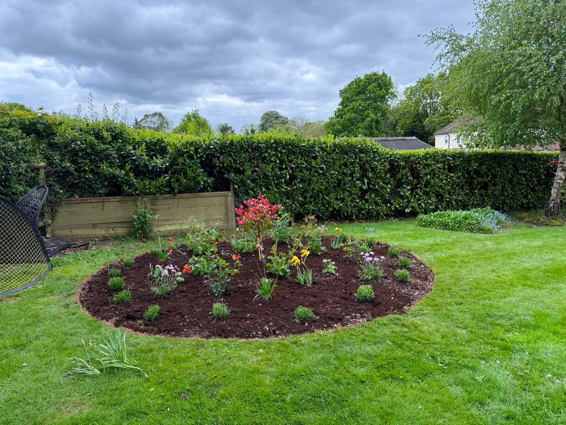 Round planting bed before and after - after