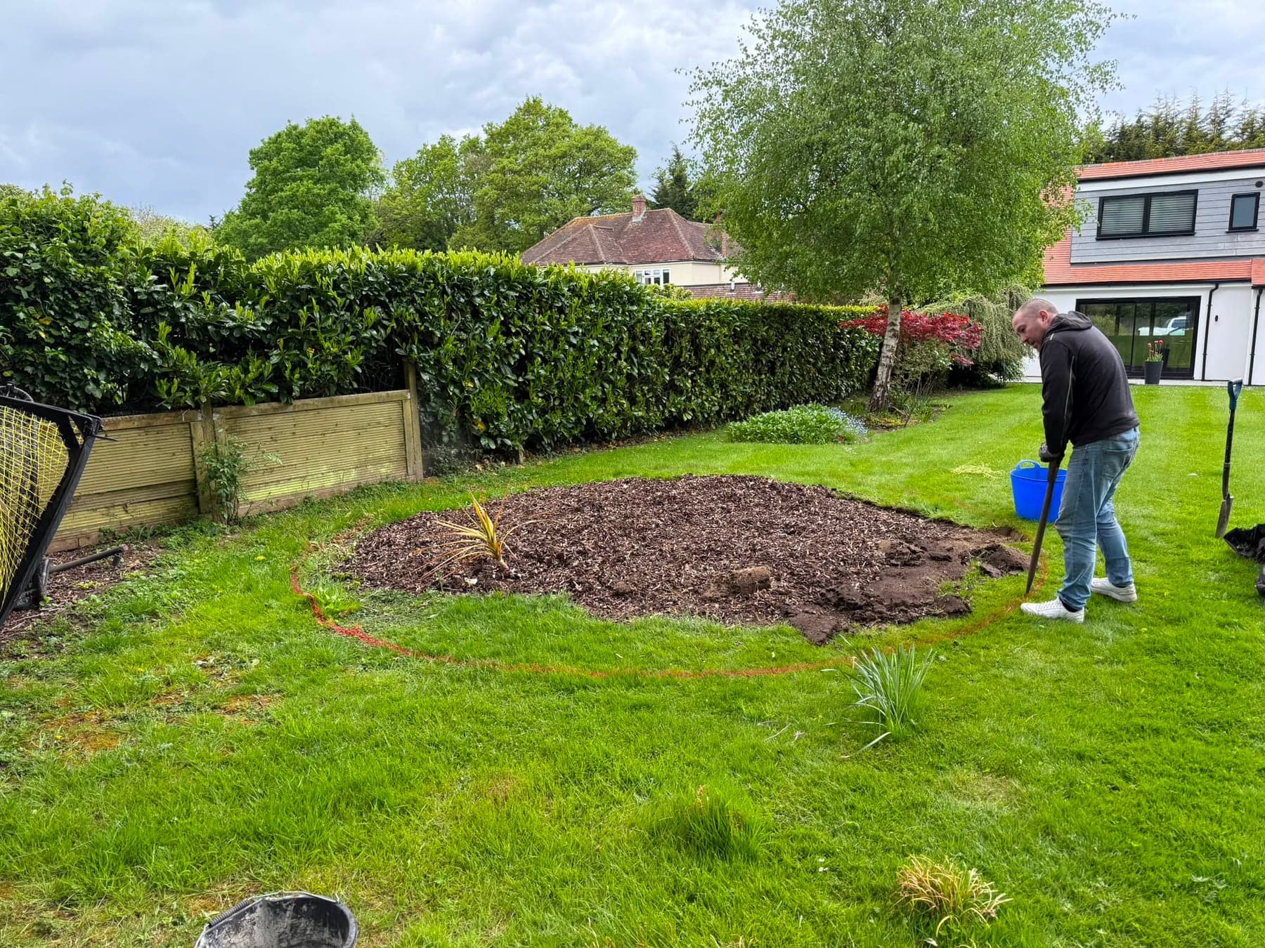 Round planting bed before and after - before